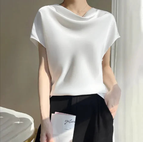 White silk satin short-sleeve blouse with a soft cowl neckline, ideal for a polished and minimalist wardrobe.